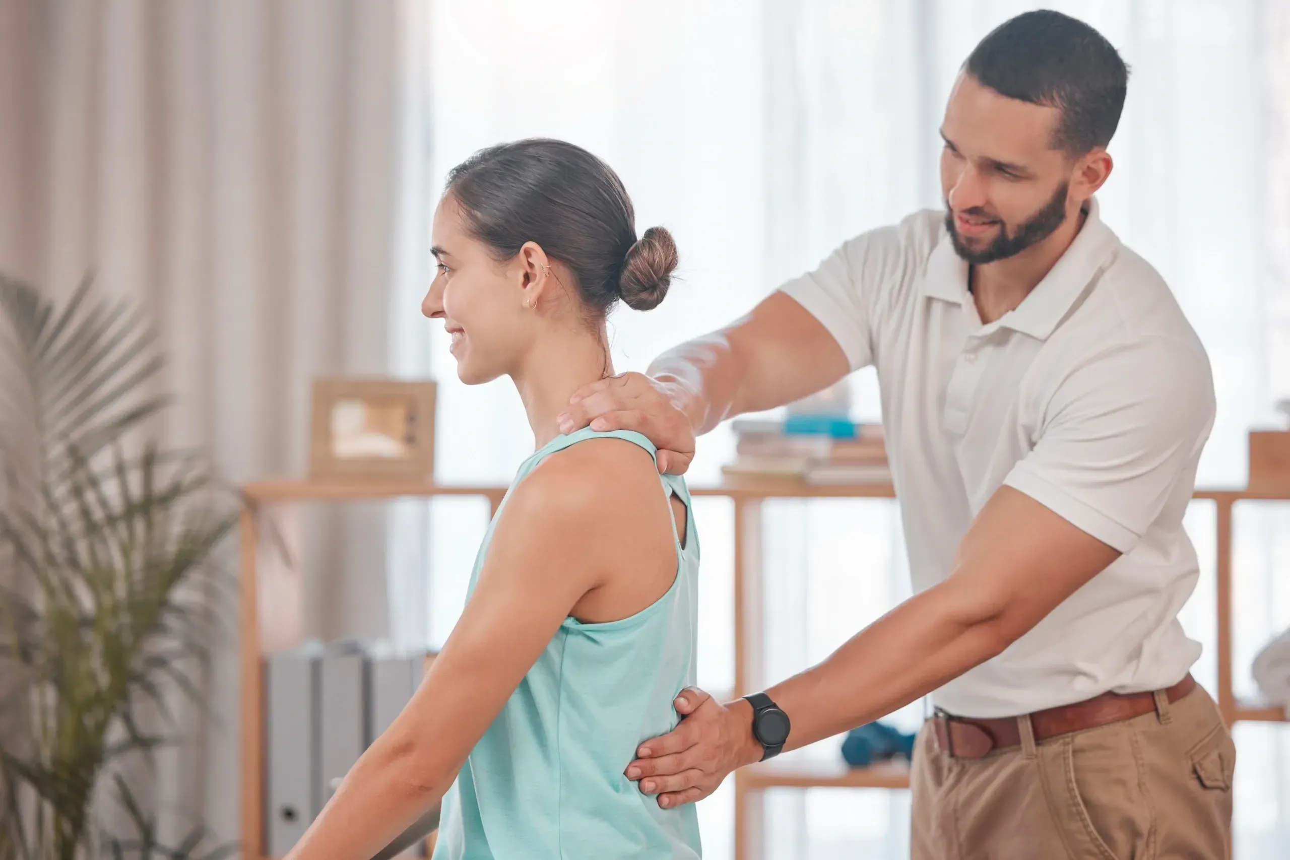 Patient receiving chiropractic adjustment for posture correction at Bensa Chiropractic and Wellness in Bradenton FL
