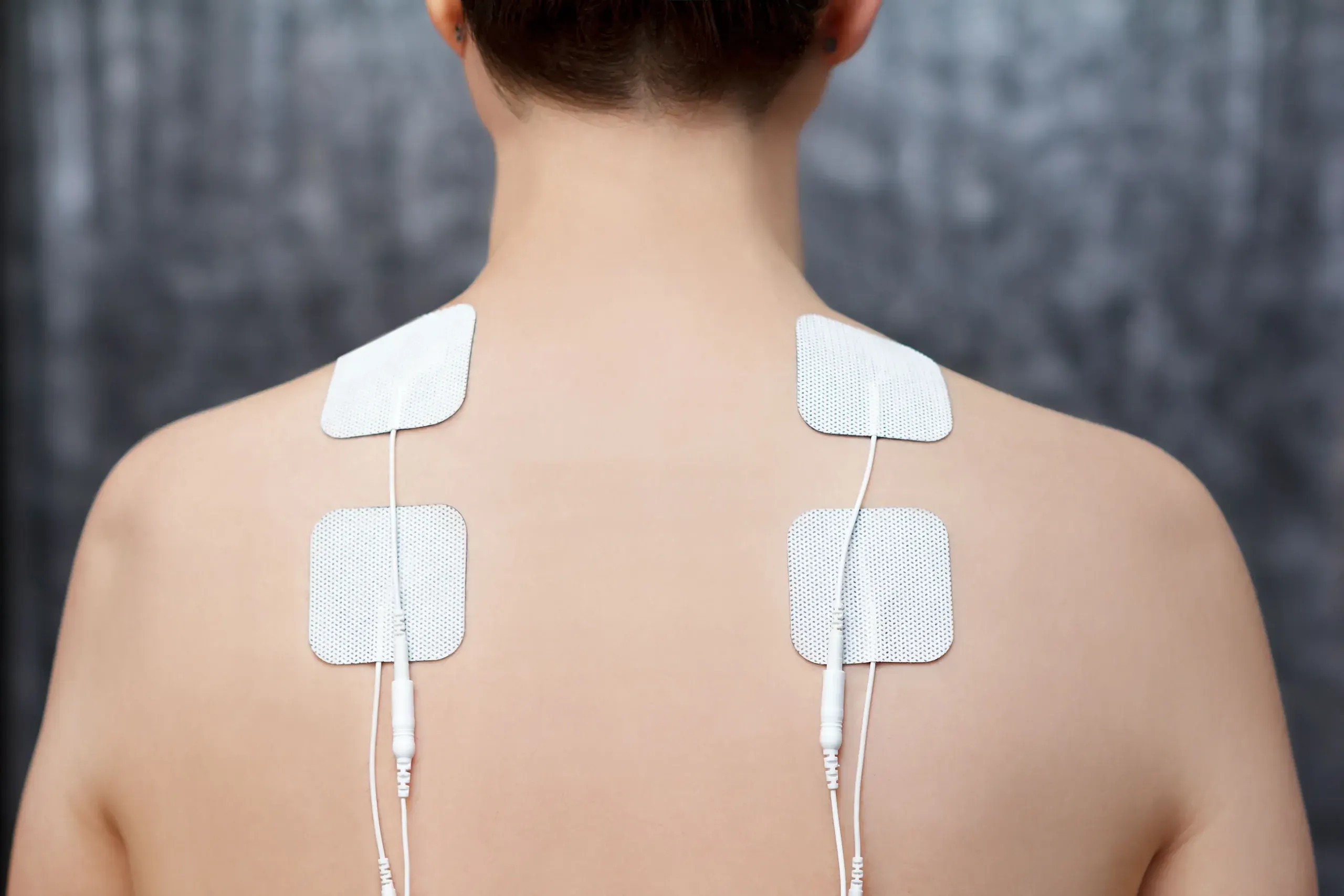 Confident patient portrait after electrical stimulation therapy at Bensa Chiropractic Bradenton