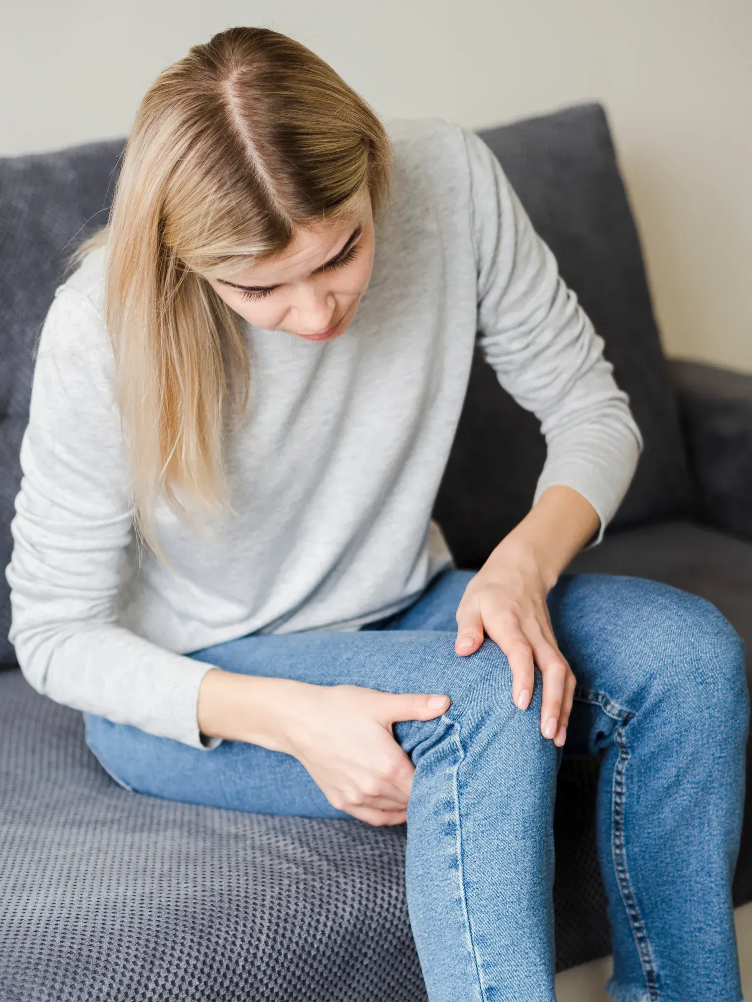 Person concerned about personal injury symptoms at Bensa Chiropractic and Wellness