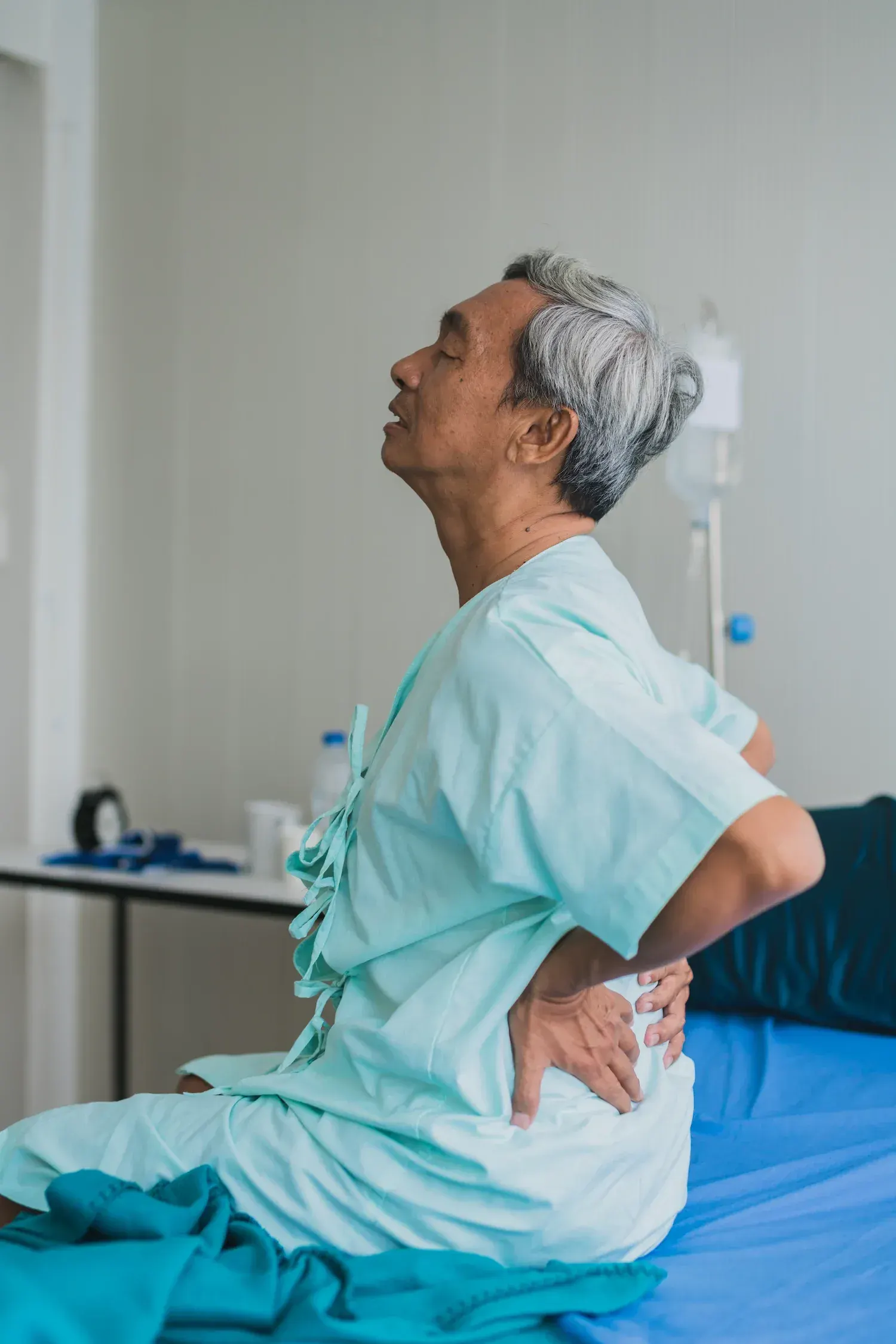Person concerned about chronic back pain at Bensa Chiropractic and Wellness